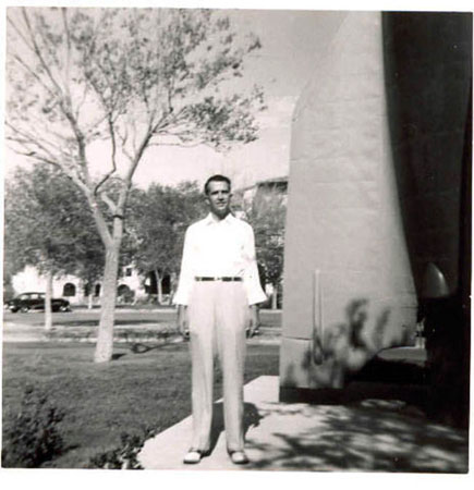 DAD AT FT BLISS TX STANDING NEXT TO MISSILE-1948