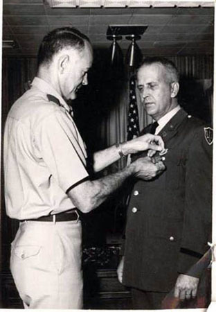 DAD RECEVING BARS AND MEDALS 